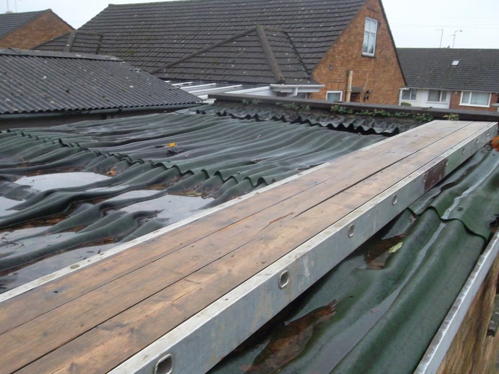 A damaged and wet roof needing a repair