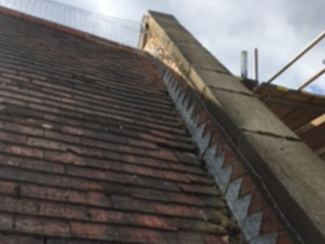 A roof with tiles and scaffolding