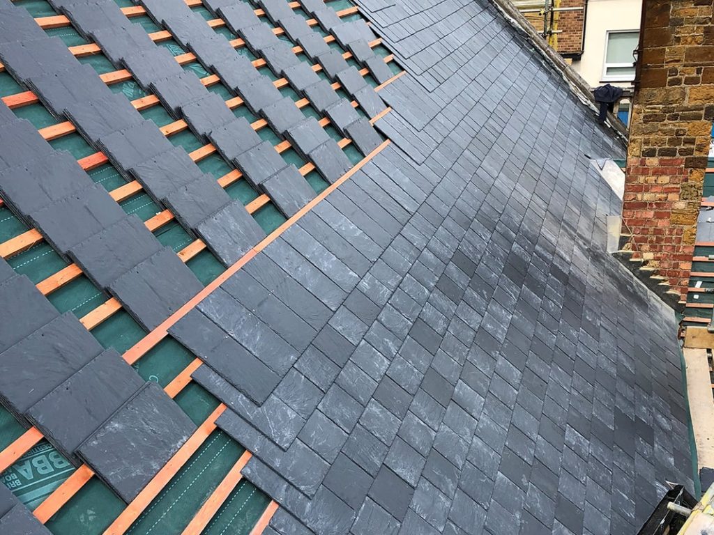 Tile roof replacement in progress